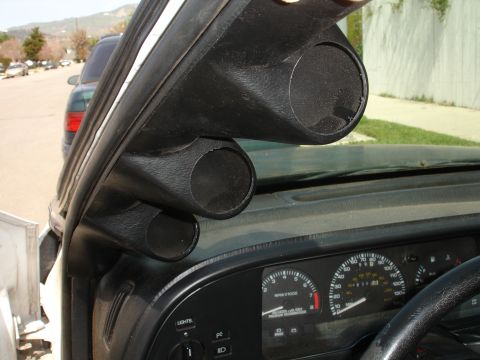 1993 Ford Taurus - Interior view of a 1993 Ford Taurus showing an aftermarket triple gauge pod installed on the A-pillar.