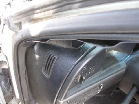 1993 Ford Taurus - Interior view of a vehicle's dashboard, focusing on the driver's side air vent and controls.