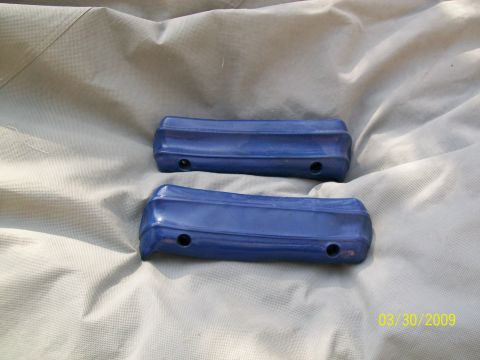1972 Ford Ranchero - Pair of blue door handles, possibly for a classic car, laid out on a tarp.