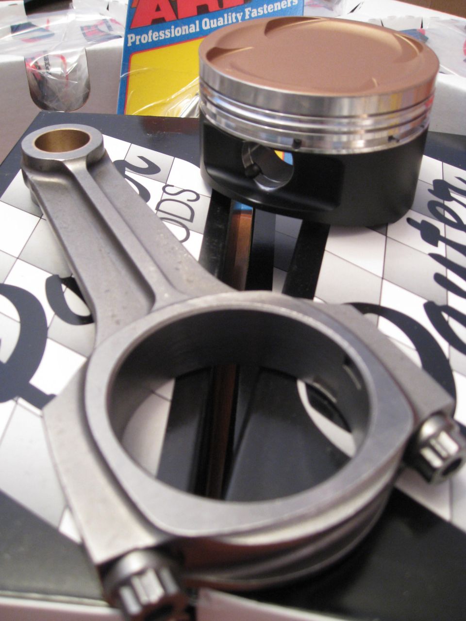 Connecting rod and piston assembly for an engine