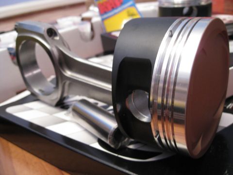 1994 Ford Probe - Close-up of a performance piston and connecting rod assembly.