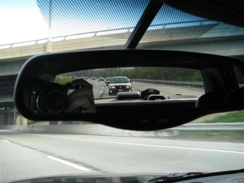 2003 Mercury Marauder - A 2003 Mercury Marauder is seen from the rear on a highway, with other vehicles in the distance.
