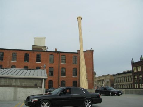 2003 Mercury Marauder - A black 2003 Mercury Marauder is seen parked in front of a brick building with a large baseball bat sculpture.