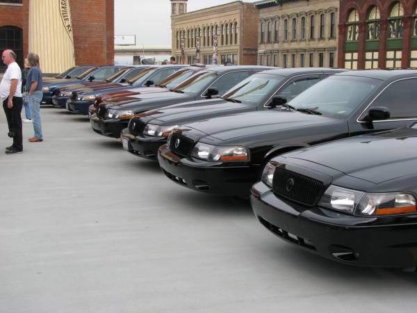 Long row of black Lincoln and Mercury sedans on a lot