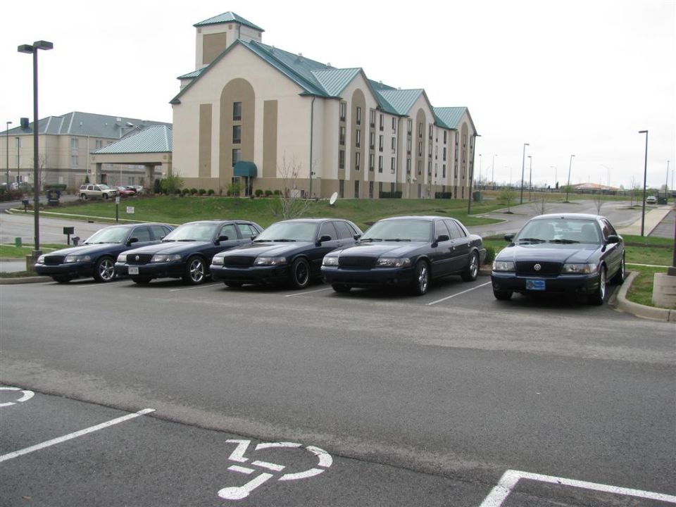 Five dark 2003 Mercury Marauders parked in a lot