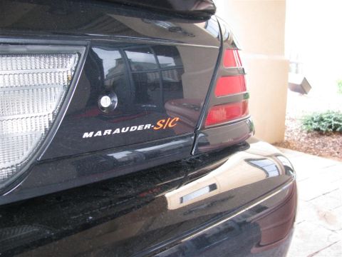2003 Mercury Marauder - Rear view of a black 2003 Mercury Marauder, showing the 'Marauder-S/C' emblem.