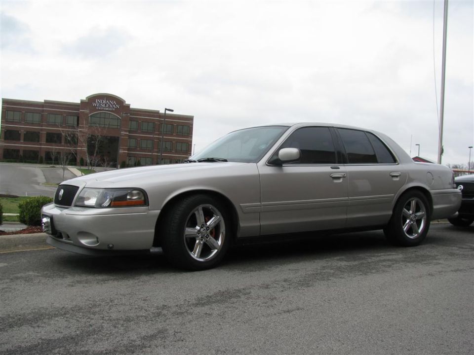 Silver 2003 Mercury Marauder parked outside a brick building