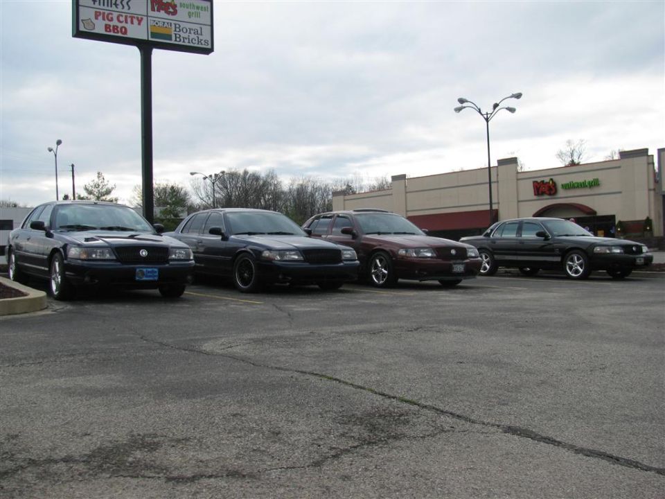 Four black 2003 Mercury Marauders parked in a lot