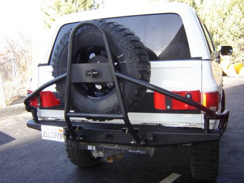 1995 Ford Bronco - won't do the side tubes out, but the hoop is the basic idea, frame mounted, fold down. Very nice for heavy tires.