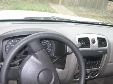 1996 Ford Thunderbird - The interior of a truck is shown, focusing on the dashboard, steering wheel, and center console.