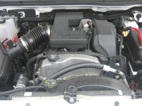 1996 Ford Thunderbird - The engine bay of a vehicle is shown with various components and hoses.