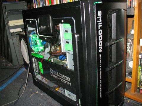 1997 Ford Crown Victoria - A black computer case with visible internal components and lighting, branding text on its side.