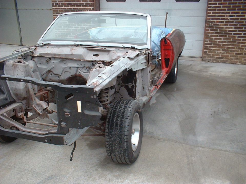 1970 Ford Torino convertible body, stripped down, red door, front end removed, in garage