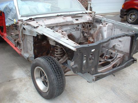 1970 Ford Torino - Front view of a 1970 Ford Torino undergoing restoration, with the engine bay exposed.