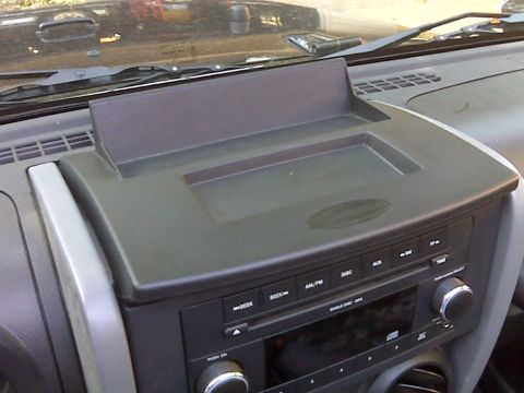 2008 Jeep Wrangler - The interior of a Jeep Wrangler, focusing on the dashboard and audio system.
