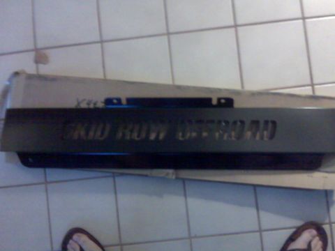 2008 Jeep Wrangler - A skid plate with "SKID ROW OFFROAD" cut out is shown, likely for an off-road vehicle.