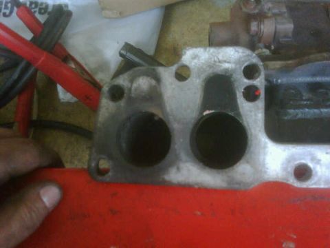 1986 Toyota Hilux - Engine intake manifold part shown with two circular ports.