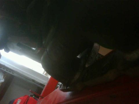 1986 Toyota Hilux - Underside view of engine components, potentially from a Toyota Hilux, with various parts visible in the darkness.