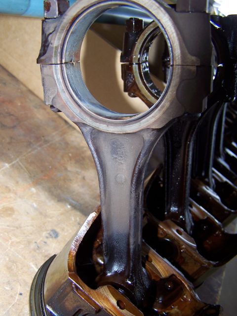 1973 Ford Ranchero - 8 tired old pistons and connecting rods; the bearings are so worn, copper is showing through! these will get shelved for a future project,…