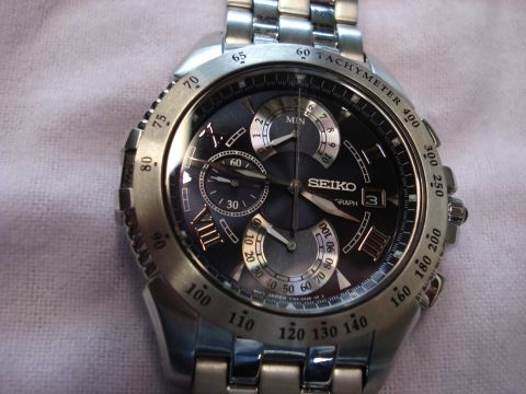 2000 Ford Crown Victoria - A close-up view of a Seiko chronograph watch with multiple subdials and a date window.