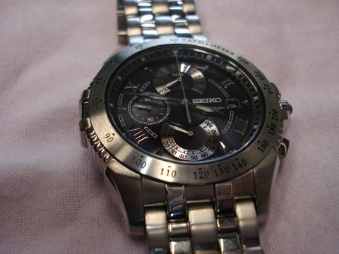 2000 Ford Crown Victoria - A detailed view of a Seiko chronograph watch, showing its metallic band and intricate dial.