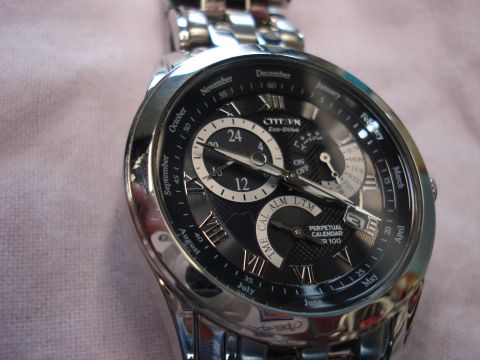 2000 Ford Crown Victoria - This Citizen Eco-Drive watch features a perpetual calendar complication and a black dial with Roman numeral hour markers.