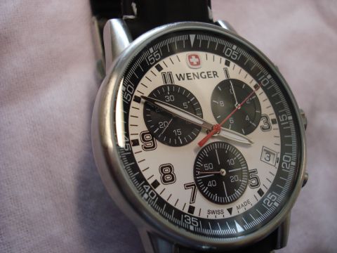 2000 Ford Crown Victoria - Close-up of a Wenger chronograph watch with a white dial and black accents.
