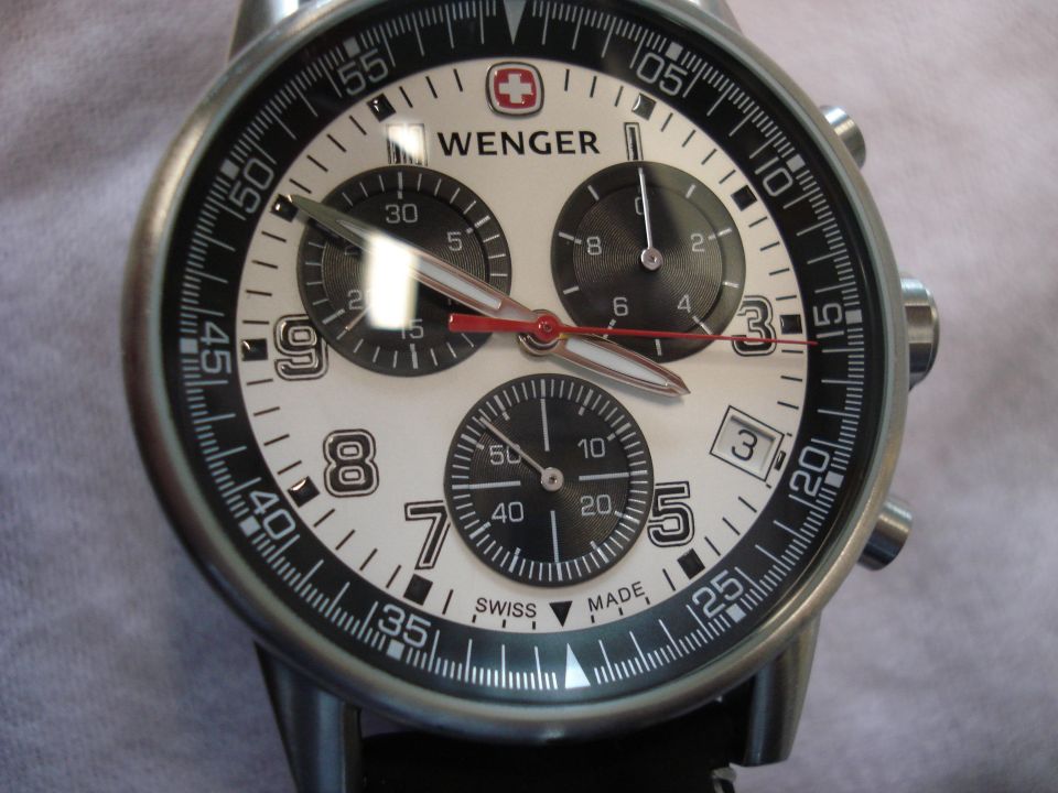 Wenger chronograph watch with white dial, black subdials, and red accents