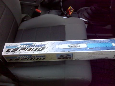 2008 Jeep Wrangler - A Pro Comp ES2000 steering stabilizer box is placed on a vehicle's seat.