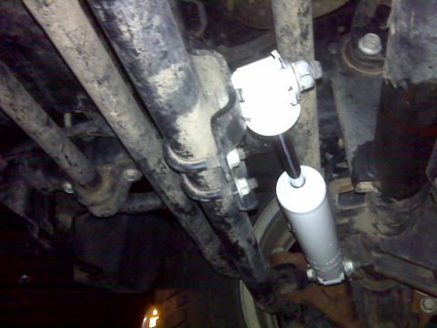 2008 Jeep Wrangler - Underside view of a steering stabilizer component, likely from a Jeep Wrangler.