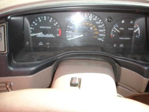 1995 Ford Taurus - Interior view of a 1995 Ford Taurus dashboard, showing the instrument cluster.
