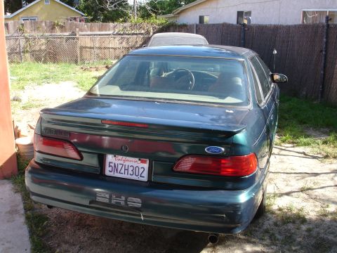 1995 Ford Taurus - Rear view of a 1995 Ford Taurus SHO, showing its distinctive taillights and California license plate.