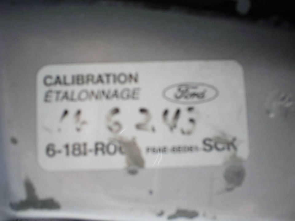 Ford calibration/étalonnage sticker with codes on a silver metal part