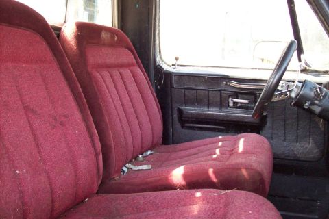 1976 Chevrolet C/K Pickup - Interior view of a 1976 Chevrolet C/K Pickup, showing the bench seat and dashboard details.