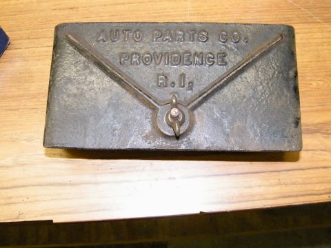 1909 Ford Model T - Cast iron plaque from Auto Parts Co. in Providence, R.I. with a central pivot mechanism.