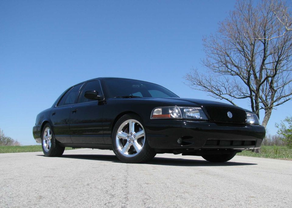 2003 Mercury Marauder parked on a road with a tree in the background