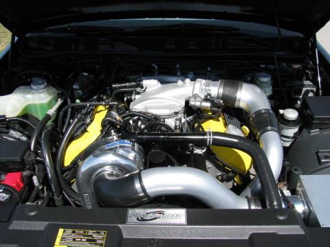 2003 Mercury Marauder - Custom engine bay features a ProCharger supercharger system and yellow valve covers.