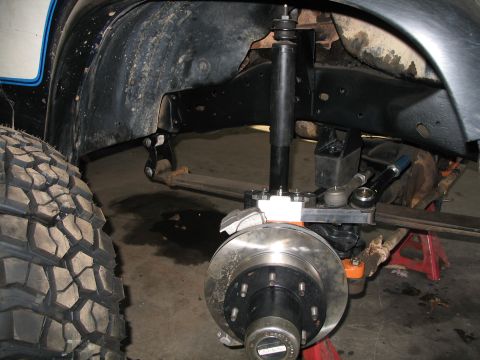 1985 Ford Bronco - Close-up view of the front suspension and wheel assembly on a 1985 Ford Bronco.