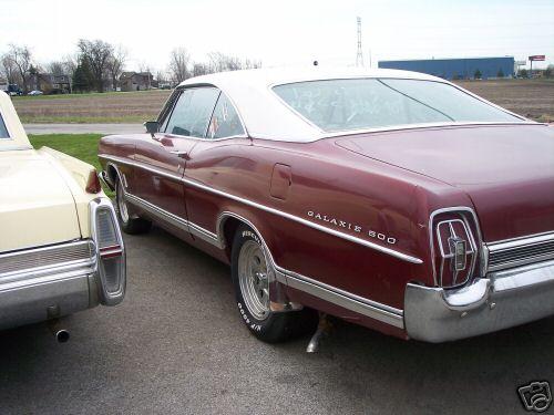 Maroon 1967 Ford Galaxie 500 with white roof, rear 3/4 view