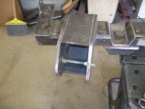 1996 Ford Bronco - Fabricated metal part with a bolt and nuts, likely for a vehicle suspension system.
