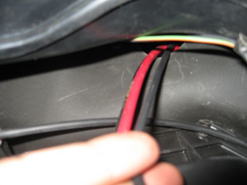 1994 Ford Bronco - A close-up view shows electrical wiring within a vehicle's interior, with no clear year identification.