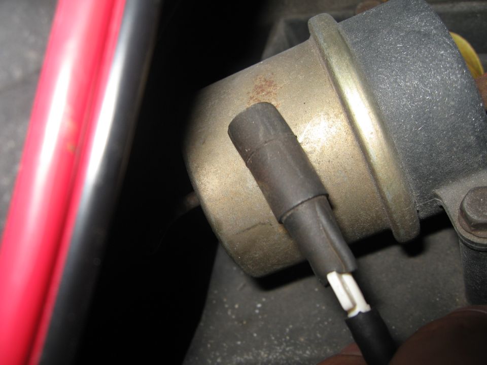 Vacuum hose connected to metal canister