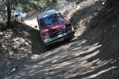 1996 Ford Bronco - Ford Bronco tackling a challenging off-road trail.