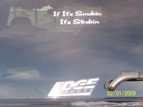 2002 Ford Excursion - A rear window displays "If It's Smokin It's Strokin" and an Edge Products sticker.