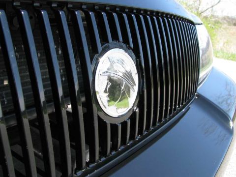2003 Mercury Marauder - The iconic Mercury emblem is centered on the black vertical grille of the car.