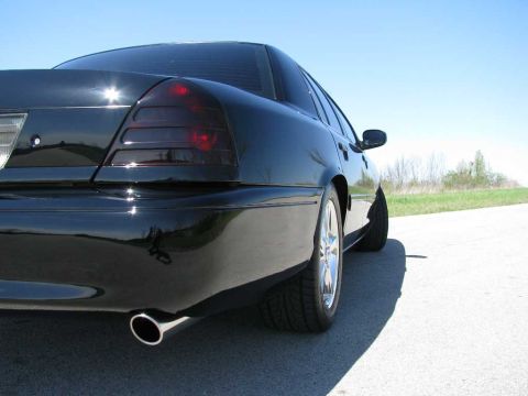 2003 Mercury Marauder - Rear quarter view of a black 2003 Mercury Marauder on a sunny day.