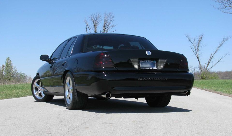 2003 Mercury Marauder rear view, black paint, tinted taillights, dual exhaust pipes