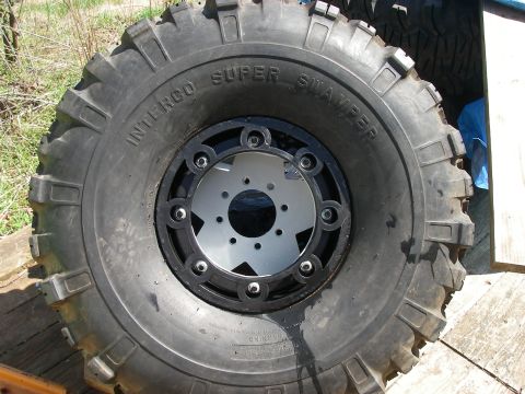 1978 Ford Bronco - A close-up view of a large off-road tire with aggressive tread and a custom rim.