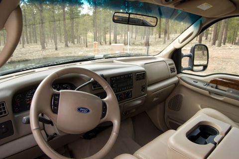 2003 Ford F-350 - The interior of a 2003 Ford F-350 is captured, highlighting the dashboard, steering wheel, and seating area.