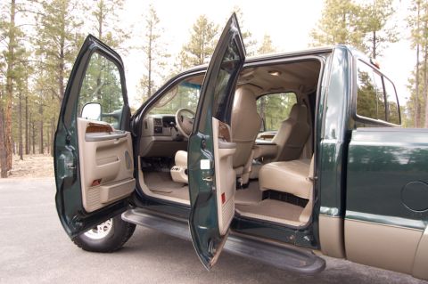 2003 Ford F-350 - Interior view of a 2003 Ford F-350 pickup truck with all doors open.